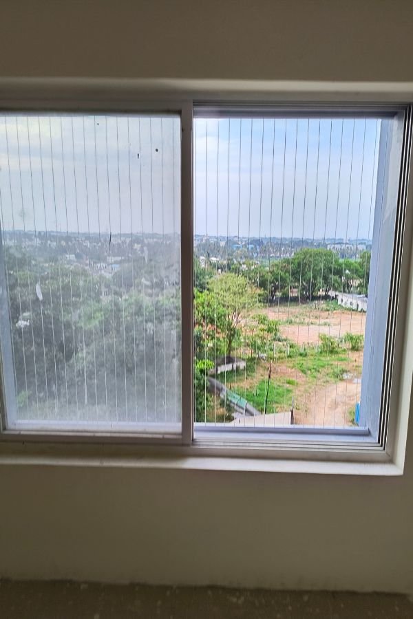 Invisible Grills for Windows in Hyderabad installed by Lasya Invisible Grills for child safety, pet protection and enhanced security without blocking the view.
