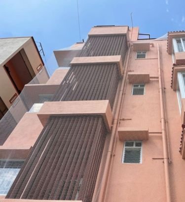 Building Covering Safety Nets in Hyderabad installed by Lasya Safety Nets for construction safety, debris protection and fall prevention in residential and commercial buildings.