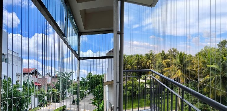 Premium Invisible Grills for Pets Safety in Hyderabad installed by Lasya Invisible Grills for balconies, windows and open spaces.